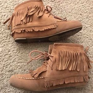 Brown moccasin style shoes with fringe